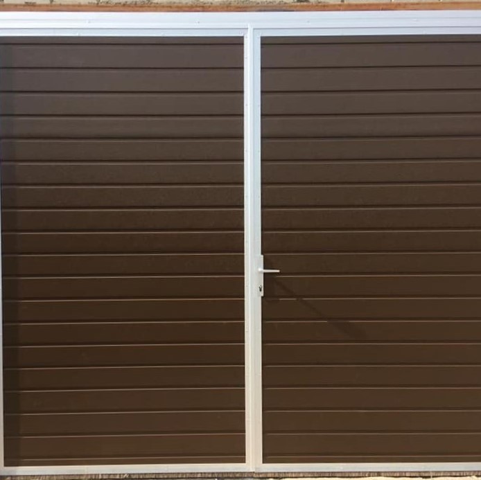 Double garage doors in dark brown colour
